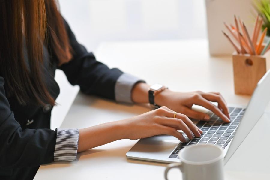 Writing for the web with a laptop.